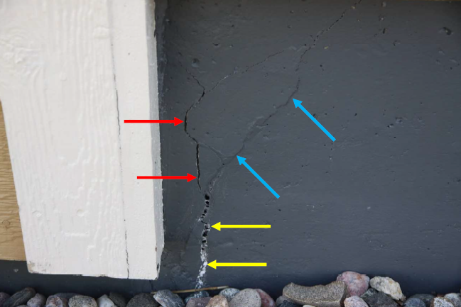 The yellow arrows indicate portion of crack that had been repaired and re-opened; blue arrows indicate portion of crack that had been repaired and had not re-opened; red arrows indicate portion of crack that appeared to have occurred after repairs were performed. 